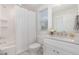 Bright bathroom with a tub/shower combo, white subway tiles, and a sleek vanity with stone countertop at 902 B Oakland Ave, Durham, NC 27705