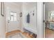 Welcoming entryway featuring a built-in bench, coat hooks, and practical storage solutions at 902 B Oakland Ave, Durham, NC 27705