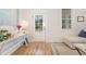 Charming entryway with a console table and a view of the front door and a cozy couch at 902 B Oakland Ave, Durham, NC 27705