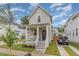 Beautiful home featuring a charming front porch, a well-manicured lawn, and private parking at 902 B Oakland Ave, Durham, NC 27705