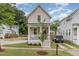Charming home featuring a covered porch, well-maintained lawn, and private driveway at 902 B Oakland Ave, Durham, NC 27705