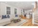 Inviting living area with a seamless flow to the kitchen and staircase, perfect for entertaining at 902 B Oakland Ave, Durham, NC 27705