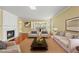 Inviting living room featuring a cozy fireplace and comfortable seating arrangement at 923 Peltier Dr, Cary, NC 27519