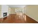 Bright living room showcasing hardwood floors and a charming fireplace at 923 Peltier Dr, Cary, NC 27519