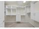 Well-organized walk-in closet with ample shelving and storage space with carpeted floor at 923 Peltier Dr, Cary, NC 27519