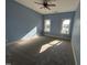 Bright and spacious bedroom with carpet floors and large windows overlooking the water at 929 Sagamore Dr, Louisburg, NC 27549