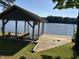 Well-maintained boat dock on the lake with a lift at 929 Sagamore Dr, Louisburg, NC 27549