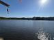 Beautiful view of the lake with treeline and the sun glistening on the water at 929 Sagamore Dr, Louisburg, NC 27549