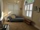 Cozy sitting room with a chaise lounge, natural light, and decorative accents at 929 Sagamore Dr, Louisburg, NC 27549