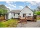Backyard view featuring a wooden deck, and a door leading to the backyard at 100 Longneedle Ct, Raleigh, NC 27603
