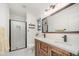 Modern bathroom features a double sink vanity, tile shower, and neutral decor at 100 Longneedle Ct, Raleigh, NC 27603