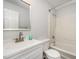 Well-lit bathroom featuring a vanity, mirror, toilet, and shower with modern fixtures at 100 Longneedle Ct, Raleigh, NC 27603