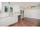 Bright kitchen features white cabinets, stainless steel appliances, and a sliding glass door at 100 Longneedle Ct, Raleigh, NC 27603