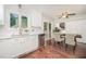 Kitchen with white cabinetry, stainless appliances, and a cozy breakfast nook at 100 Longneedle Ct, Raleigh, NC 27603