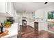 Updated kitchen with stainless steel appliances, white cabinets, and subway tile backsplash at 100 Longneedle Ct, Raleigh, NC 27603