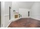 Bright living room features vaulted ceilings, brick fireplace, and hardwood floors at 100 Longneedle Ct, Raleigh, NC 27603