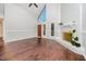 Spacious living room with vaulted ceilings, brick fireplace, and large windows at 100 Longneedle Ct, Raleigh, NC 27603