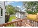 Backyard shed featuring a porch, wood and gravel landscape, and string lights at 100 Longneedle Ct, Raleigh, NC 27603