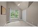 Cozy bedroom with neutral walls, a window offering natural light, and a closet at 1003 Gloucester Ct, Chapel Hill, NC 27516