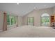 Spacious bedroom with vaulted ceilings and three large windows at 1003 Gloucester Ct, Chapel Hill, NC 27516