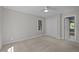 Neutral bedroom with a ceiling fan and large window for natural light at 1003 Gloucester Ct, Chapel Hill, NC 27516