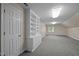 Spacious bonus room with carpeting, built-in shelving, and a window for natural light at 1003 Gloucester Ct, Chapel Hill, NC 27516