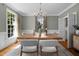 Chandelier-lit dining room with a large window that provides natural light and views to the outside at 1003 Gloucester Ct, Chapel Hill, NC 27516