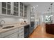Well-equipped kitchen with stainless steel appliances, custom cabinetry, and a separate beverage refrigerator at 1003 Gloucester Ct, Chapel Hill, NC 27516