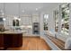 Bright kitchen with stainless steel appliances, center island and a window bench at 1003 Gloucester Ct, Chapel Hill, NC 27516