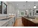 Bright kitchen featuring modern appliances, a central island with cooktop, and a cozy window seat at 1003 Gloucester Ct, Chapel Hill, NC 27516