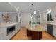 Open kitchen with an island and stainless steel appliances, which combines functionality with style at 1003 Gloucester Ct, Chapel Hill, NC 27516