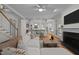 Spacious living room features a fireplace, stairs to the second floor and views of the kitchen at 1003 Gloucester Ct, Chapel Hill, NC 27516