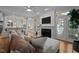 Open living room boasts a fireplace and views of kitchen with an eat-in breakfast bar at 1003 Gloucester Ct, Chapel Hill, NC 27516