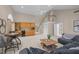Spacious living area with wet bar, staircase, comfortable seating, and large windows at 1003 Gloucester Ct, Chapel Hill, NC 27516