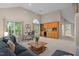 Bright living area with a bar, large windows, modern furnishings, and an open layout at 1003 Gloucester Ct, Chapel Hill, NC 27516