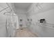 Organized walk-in closet with shelving and plenty of space for storage at 1003 Gloucester Ct, Chapel Hill, NC 27516