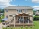 The backyard is spacious with a large deck, patio, and well maintained lawn at 1008 Wolfs Bane Dr, Apex, NC 27539