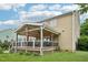 Exterior view showing the home's deck and well-kept lawn at 1008 Wolfs Bane Dr, Apex, NC 27539