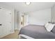 Neutral bedroom design with grey comforter, plush pillows and carpet at 1008 Wolfs Bane Dr, Apex, NC 27539