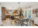 Dining table beside the kitchen with stainless steel appliances and island at 1008 Wolfs Bane Dr, Apex, NC 27539