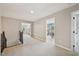 Spacious hallway with neutral tones, showcasing access to bedrooms for a seamless layout at 1008 Wolfs Bane Dr, Apex, NC 27539