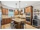 Well-appointed kitchen with granite countertops, stainless appliances, and stylish lighting at 1008 Wolfs Bane Dr, Apex, NC 27539