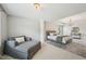 Open main bedroom with sitting area, neutral paint, and decorative rug at 1008 Wolfs Bane Dr, Apex, NC 27539