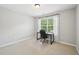 Bright home office setup, featuring desk, chair, and natural light for a productive workspace at 1008 Wolfs Bane Dr, Apex, NC 27539