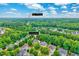 Aerial view of property, highlighting proximity to Devils Ridge Golf Club, lush greenery, and neighborhood setting at 101 Ironcreek Pl, Apex, NC 27539