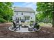Spacious backyard featuring a fire pit, deck and ample seating for entertaining at 101 Ironcreek Pl, Apex, NC 27539
