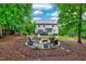 Large backyard showcasing a fire pit and a spacious seating area at 101 Ironcreek Pl, Apex, NC 27539