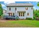Expansive backyard with a well-maintained lawn, a wooden deck, and lush landscaping for outdoor enjoyment at 101 Ironcreek Pl, Apex, NC 27539
