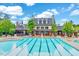 Beautiful community pool featuring lounge chairs, umbrellas, and lush landscaping at 101 Ironcreek Pl, Apex, NC 27539