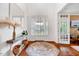 Bright foyer with gleaming hardwood floors and elegant decor creating an inviting entrance at 101 Ironcreek Pl, Apex, NC 27539